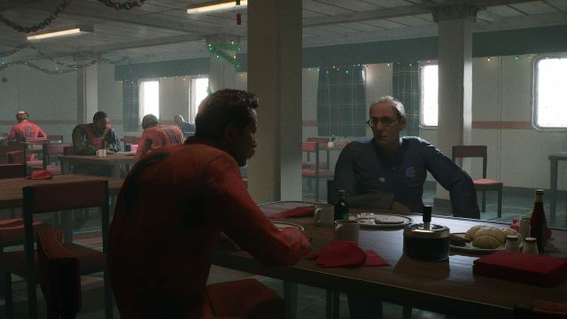 Oil rig works eat in the canteen in Still Wakes the Deep